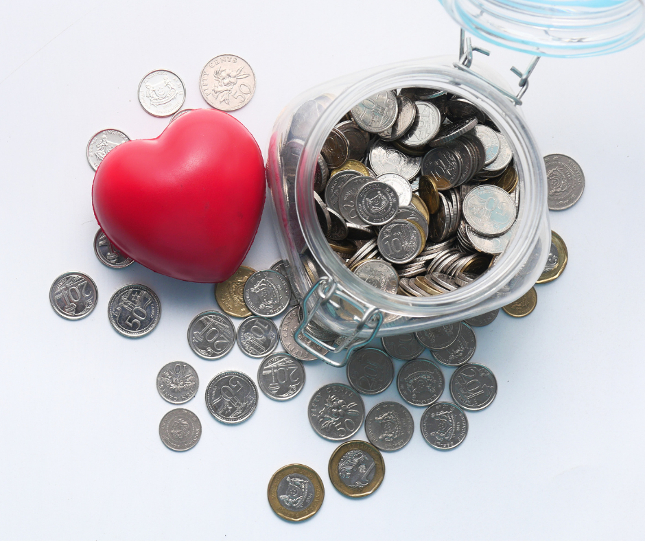 tax credit donations represented by a jar full of coins and a red heart