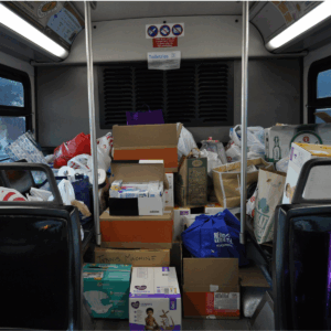 Photo from inside a Sun Tran bus showing items being donated at the Emerge Stuff the Bus